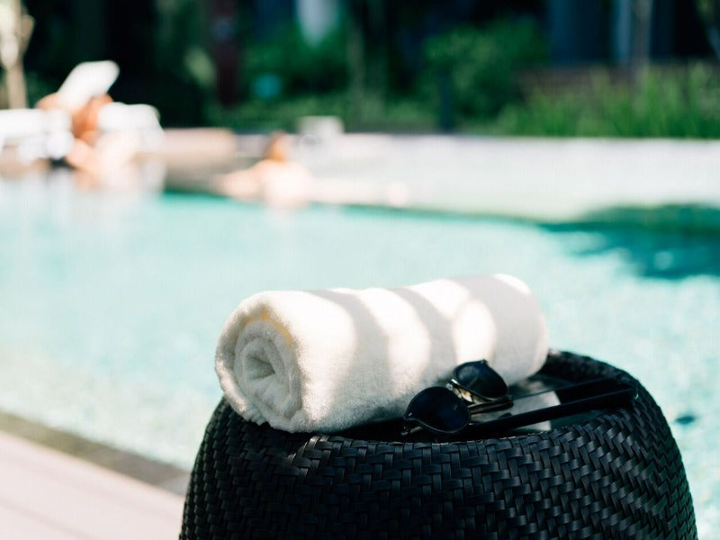 Yellow Towel Rolled Poolside