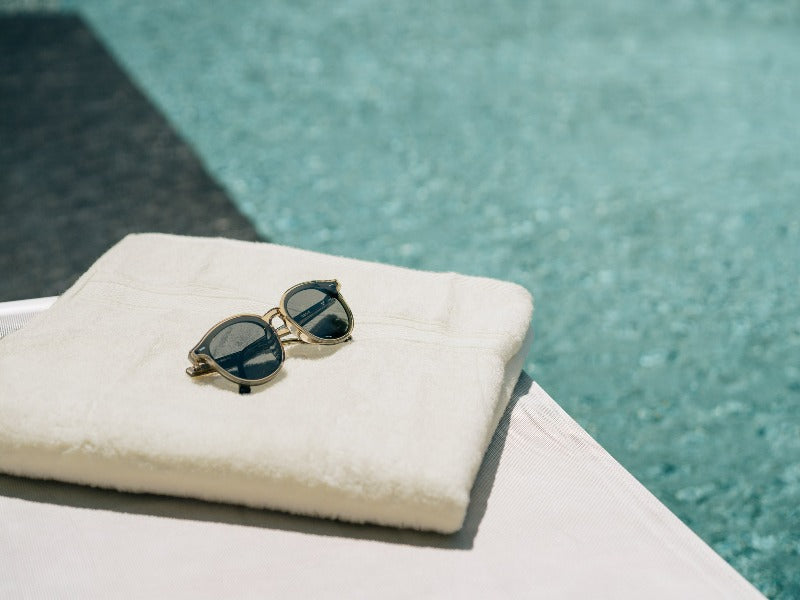 yellow towel poolside edge
